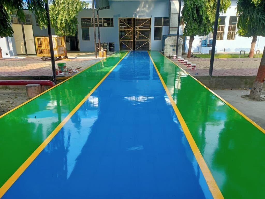 Finished industrial epoxy flooring walkway installed by RR Infra Solutions